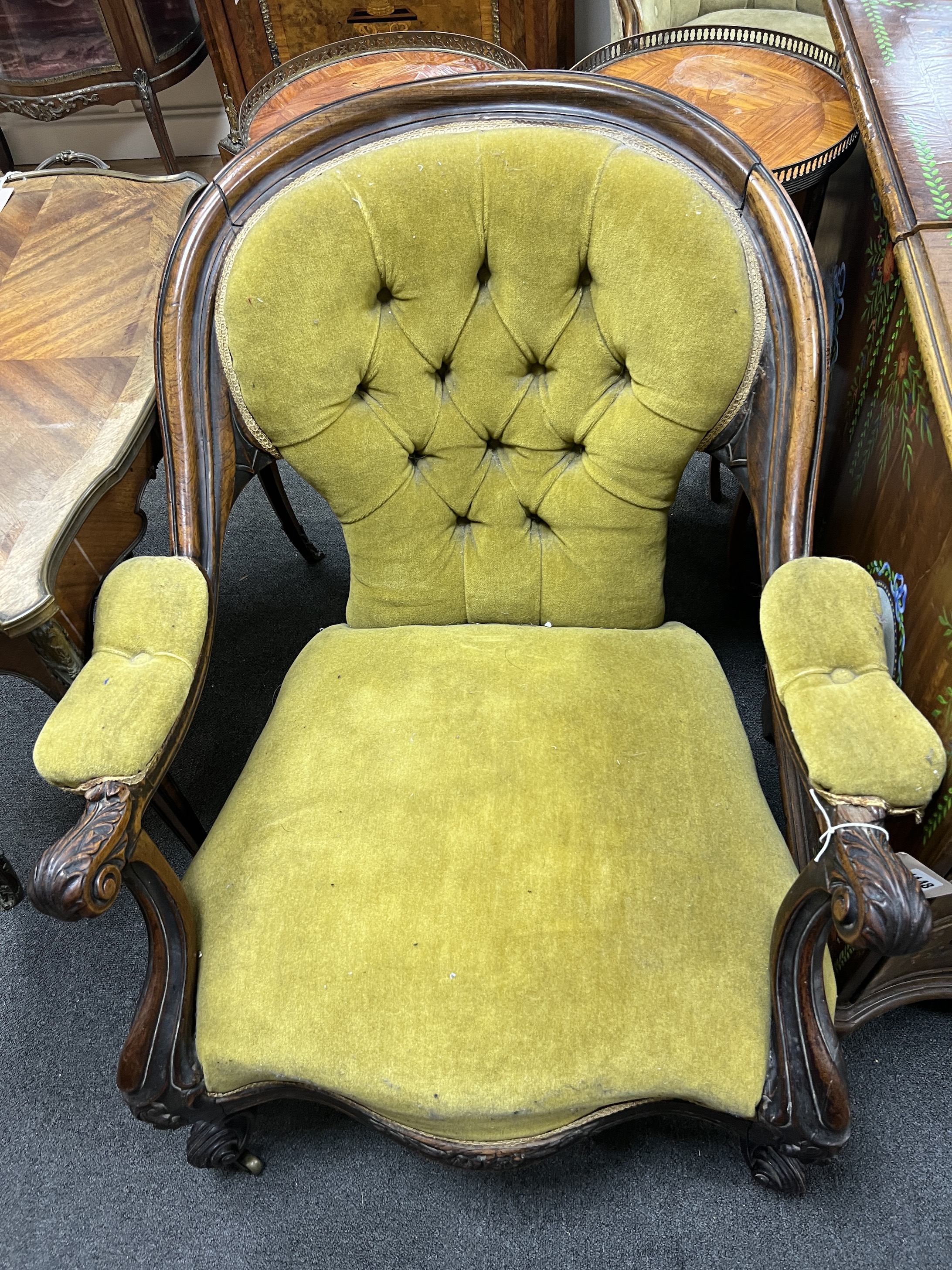 A Victorian rosewood upholstered open armchair, width 71cm, depth 72cm, height 79cm